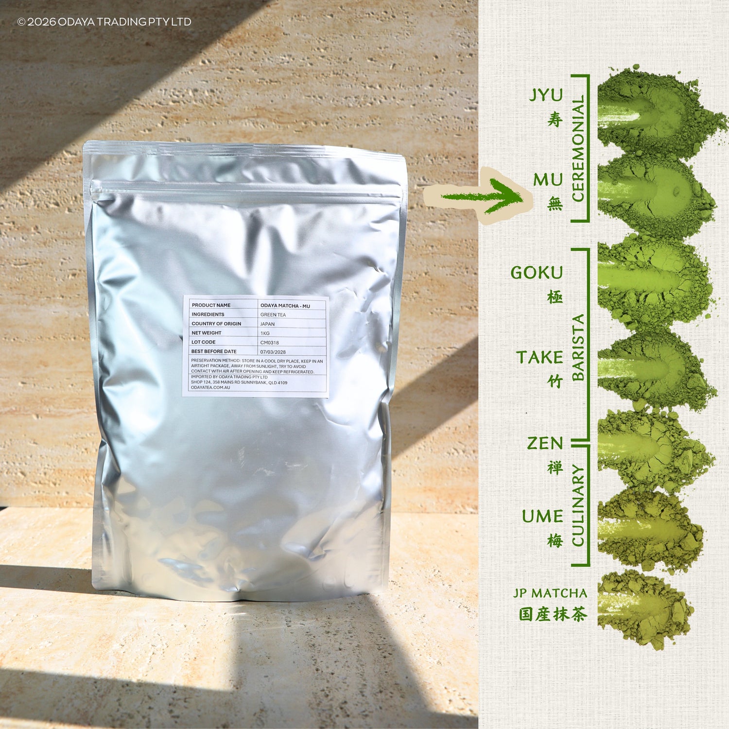 A silver resealable pouch of matcha tea powder stands on a stone surface beside a vertical informational panel showing different matcha grades and their green powder samples. The pouch has a white label with small text, and the right panel includes Japanese/English text labels for JYU, MU, GOKU, TAKE, ZEN, UME, and JP MATCHA with corresponding green powder swatches.
